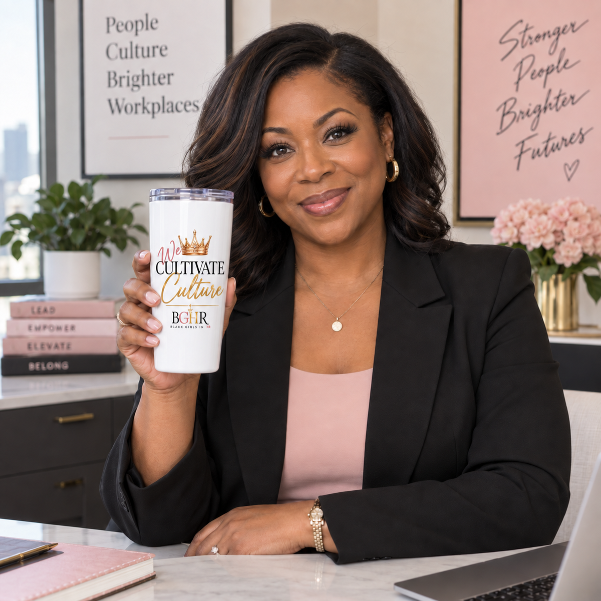 Black woman HR professional holding the BGHR We Cultivate Culture tapered tumbler in an office